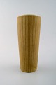 Large Rörstrand 
"Ritzi" ceramic 
vase in fluted 
style.
Sweden, 1960s.
Beautiful 
glaze in ...