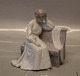 Bing and 
Grondahl Art 
Nouveau B&G 
1580 Woman 
sitting on 
bench 14.5 x 15 
cm Marked with 
the three ...