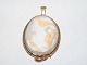 Cameo pendant 
from 1870-1900 
with carved 
womans face and 
gilded 
mounting.
Measures 5.5 
by 3.8 ...