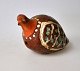 Bird whistle, 
19th century. 
Denmark. Clay 
with overglaze 
in brown, green 
and white. L .: 
10 cm. ...