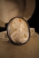 Old 1800 
century kamé 
brooch with 
woman portrait 
carved in 
Konkylie and 
embossed in ...