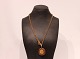 Gilded 925 
sterling silver 
necklace with 
large pendant 
by Dyberg Kern.
60 cm.