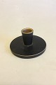 Aluinia 
Bremerholm 
Candle Holder 
with brown 
glaze No 
4/1491. 
Measures 12 cm 
/ 4 23/32 in. 
dia.