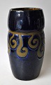 Jugend vase, 
approx. 1920, 
Denmark. 
Redware, with 
glaze in blue. 
Height: 22 cm.
NB: Small 
glaze ...