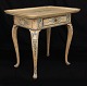 An original 
decorated 
Rococo table 
with blue ...