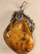 Large Amber 
pendant.
Width of 
amber: 5.6 cm. 
Height: 7.2 cm.
total length 
with ax: 9.5 
...