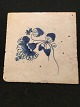 Dutch tile.
  from the end 
of the 18th 
century, with 
flowers (mussel 
fluted pattern) 
and ...