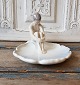 B&G Nude boy on 
water lily 
No. 1660, 
Factory first. 
Height 14 cm. 
Dimensions 19 x 
22 ...