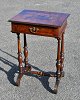 Sewing table, 
veneered 
walnut, from 
1860 - 1880, 
Denmark. Walnut 
root. Polished 
beech legs. 
With ...