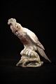 Dahl Jensen 
(DJ) porcelain 
figure of 
little cockatoo 
marked with 
royal crown 
(Royal ...