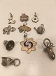 Charms pendant 
in silver.
Dog with 
enamel, 
four-clover, 
flower with 
enamel.
Elephant, Pig 
with ...