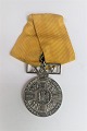 Denmark. The Copenhagen fire brigade long service medal. 25 years. Silver with yellow ribbon. ...