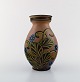 Kähler, HAK, 
glazed 
stoneware vase 
in modern 
design.
1930 / 40's. 
Cow horn 
technique. 
Flowers ...