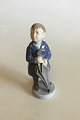 Royal 
Copenhagen 
Figurine of Boy 
with Umbrella, 
April No 4526. 
Measures 16 cm 
/ 6 19/64 in.