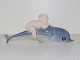 Rare Royal 
Copenhagen 
figurine, 
cherub or faun 
riding a 
dolphin.
Decoration 
number ...