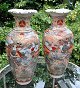A pair of 
Japanese 
Satsuma vases, 
19th century 
Faience. 
Hand-painted 
scenes with 
fighting ...