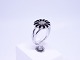 Black daisy 
ring by 
Christina 
Jewelry of 925 
sterling 
silver.
Size - 57.
