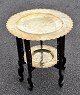 Chinese Smoking 
table, 19th 
century. Wooden 
frame with 6 
carved legs. 
With two brass 
plates with ...