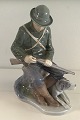 Royal 
Copenhagen 
Figurine Hunter 
with dog No 
1087. Measures 
20cm x 10cm 
(7.87 in x 3.93 
in). ...