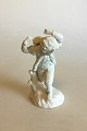 Royal 
Copenhagen 
Bisque Figurine 
of Boy carrying 
? Measures 19 
cm / 7 31/64 
in.