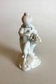 Royal 
Copenhagen 
Bisque Figurine 
of Gilr with 
Sheaf and 
Sickle. 
Measures 19 cm 
/ 7 31/64 in.