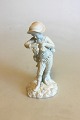 Royal 
Copenhagen 
Bisque Figurine 
of Boy with 
Grapes. 
Measures 20 cm 
/ 7 7/8 in. 
With Repair.