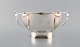 Henry 
Wilkinson. 
English 
silversmith, 
Sheffield. 
Modernist 
silver bowl on 
foot with 
handles. ...
