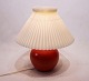 Ceramic tablelamp with orange glaze by Herman A. Kähler.
5000m2 showroom.