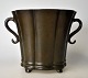 Just Andersen 
beaker in 
patinated metal 
with two 
handles, 20th 
century 
Denmark. 
Stamped, no. D 
...
