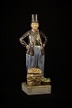 Royal 
Copenhagen 
figure of man 
in national 
costume.
Height: 31cm. 
Decoration 
number: ...