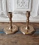 Pair of Baroque 
brass candle 
sticks approx. 
year 1750. 
One appears 
with repair on 
the base - ...