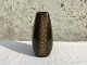 Ceramic vase, 
Brown with 
circle 
decoration, 
18cm high, 
Stamped 545 
'perfect 
condition *