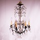 Chandelier of 
brass and 
polished prisms 
from France 
around the 
1920s.
H - 68 cm and 
Dia - 40 cm.

