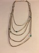 5 Row Silver 
Necklace with 
Turquoise.
Silver 
Sterling.
chain: length: 
54.5 cm.
contact Phone 
...
