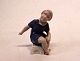 Porcelain 
figurine, 
sitting girl, 
no.: 2258 by 
Bing and 
Grøndahl.
H - 11 cm and 
Dia - 6 cm.

