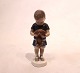 Porcelain 
figurine, boy 
with dog, no. 
1747, by Bing 
and Grøndahl.
H - 16 cm and 
Dia - 5 cm.
