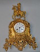 French gilt-bronze marble clock, approx. 1830. Top figure in the form of a king. At lower part ...
