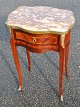 French table 
with intarsia 
and gilt edges 
and fittings, 
19th century. 
With 
red-marbled 
marble ...
