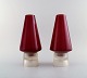 Per Lütken for Holmegaard. Et par sjældne hyggelamper til stearinlys i rødt og 
klart kunstglas. Designet i 1958.