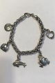 Georg Jensen 
Sterling Silver 
Charm Bracelet. 
With charms: 
Frog, Elephant, 
Dolphins, a 
Henning ...