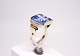 Ring of 14 ct. 
gold decorated 
with small 
clear stones 
and a large 
topaz.
Size - 55.