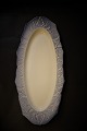 Royal 
Copenhagen oval 
fishing dish. 
61x26cm. 
2.sort. from 
before 1923. 
Here small 
glaze dots ...