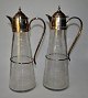 Pair of 
silver-plated 
German wine 
jugs, 20th 
century Art 
Deco. Glass 
with geometric 
grinding. ...