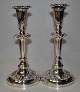 Pair of silver plated candlesticks, 19th century England. Decoration with wine leaves. H: 25.4 ...