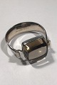Georg Jensen 
Sterling Silver 
Smoke-coloured 
Rutile Quartz 
Arm Ring No 203 
Torun Arm ring 
inside ...