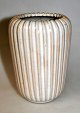 Johansen, Einar 
(1906 -) 
Denmark: Vase. 
Clay with light 
glaze. Fluted. 
Stamped: EJO 
60. Height: ...