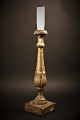 Antique Swedish 
1800 century 
candlestick in 
wood with 
remnants of old 
gold coating 
and with a ...