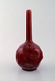 Rörstrand, 
Sweden. Early 
vase with 
narrow neck in 
glazed faience. 
Beautiful deep 
red glaze. Ca. 
...