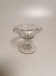 Candy glass of 
clear glass 
optically 
twisted with 
reverse rim on 
basin 
Glassworks? H. 
8cm D.9.6cm.