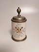 Small 19th 
century faience 
mug with tin 
lid and tin on 
the bottom. 
14cm.